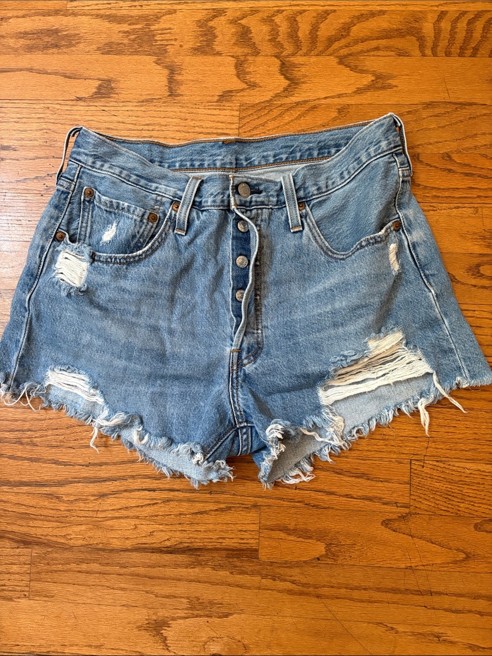 High-Rise Distressed Levi’s Strauss 501 Denim Jean Shorts in Light Blue